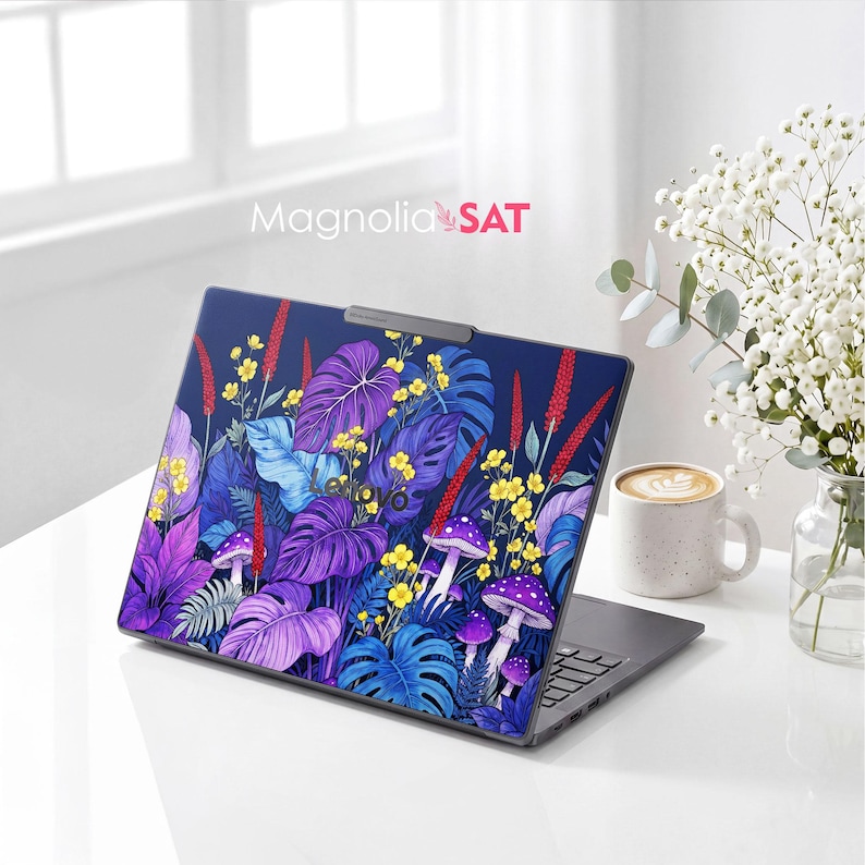 May include: A laptop skin featuring a vibrant botanical pattern with purple and blue monstera leaves, yellow wildflowers, red spikes, and purple mushrooms on a dark blue background. The text Magnolia SAT is printed above the laptop.