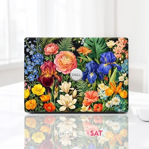May include: A Dell laptop featuring a vibrant floral skin with a black background. The design displays a dense arrangement of colorful flowers including orange, pink, red, blue, and white blossoms, along with green fern and monstera leaves.