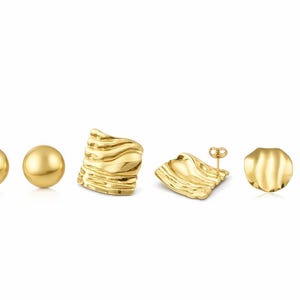 May include: A selection of gold-coloured earrings in different styles. The image shows two pairs of round stud earrings, two pairs of textured, wave-like earrings, and a pair of flat, disc-shaped earrings. All pieces have a polished finish.