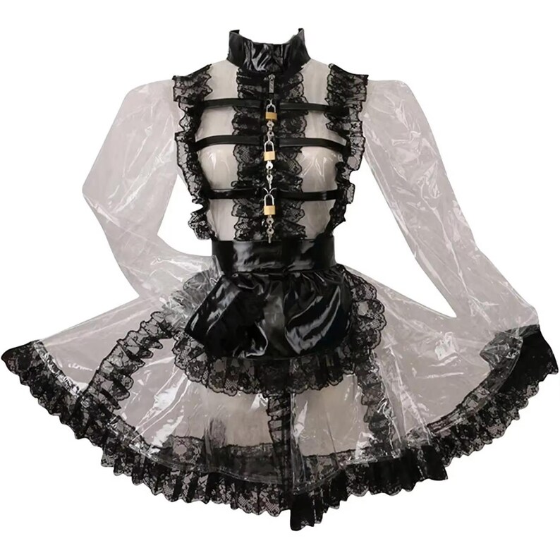 K&ouml;nnte beinhalten: Ein transparentes Kleid mit schwarzer Spitzenborte und einer schwarzen Satinschleife. Das Kleid hat einen hohen Kragen, ein schwarzes lederartiges Oberteil mit goldfarbenen Vorh&auml;ngeschl&ouml;ssern und lange, transparente &Auml;rmel. Der Rock ist mit schwarzer Spitze versehen.