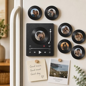 May include: A set of black circular photo magnets resembling vinyl records and a square black magnet designed like a music player interface with a central photo. Two paper notes are attached, one with the text Good music Good mood Good day.