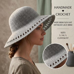 May include: A light gray handmade crochet sun hat with a wide brim featuring a detailed lace pattern. The text on the image reads: HANDMADE CROCHET, WIDE BRIM SUN HAT, DETAILED LACE BRIM, SIZES S/M/L, CUSTOM FIT. A circular inset shows a close-up of the texture.
