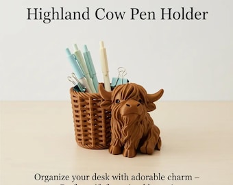 May include: A brown Highland cow pen holder featuring a textured basket-style container for writing instruments. The cow figure has detailed fur, horns, and dark eyes. Several light blue and white pens and metal binder clips are inside the holder.