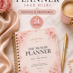 May include: A spiral-bound Islamic planner with a soft pink floral cover, featuring the text 'THE MUSLIM PLANNER', '2027 | 1448-1449 AH', and a Quranic verse. The cover includes Arabic calligraphy, a gold pen, and a string of prayer beads.