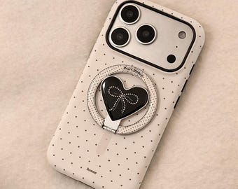 Funda para iPhone con diseño de corazón y lunares, soporte magnético y cubierta protectora a prueba de golpes.