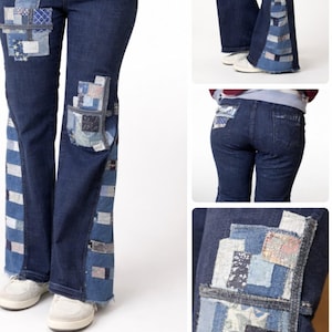 May include: Dark wash denim jeans with patchwork details. The jeans feature patches of various blue fabrics on the front pockets, sides, and flared leg bottoms. The patchwork adds a unique, handcrafted aesthetic to the classic denim style.