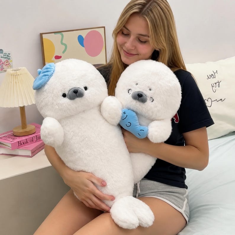 Kawaii sleeping seal plush with soft white plush fabric and PP cotton filling, cute seal pillow for kids and adults, large 70cm size perfect for cuddling and home decor, calming plush toy for bedrooms, sofas, and living room styling, adorable animal plushie for a cozy touch in any room, comforting seal stuffed animal for relaxation and stress relief, perfect gift for children and seal lovers, cute addition to any home decor collection