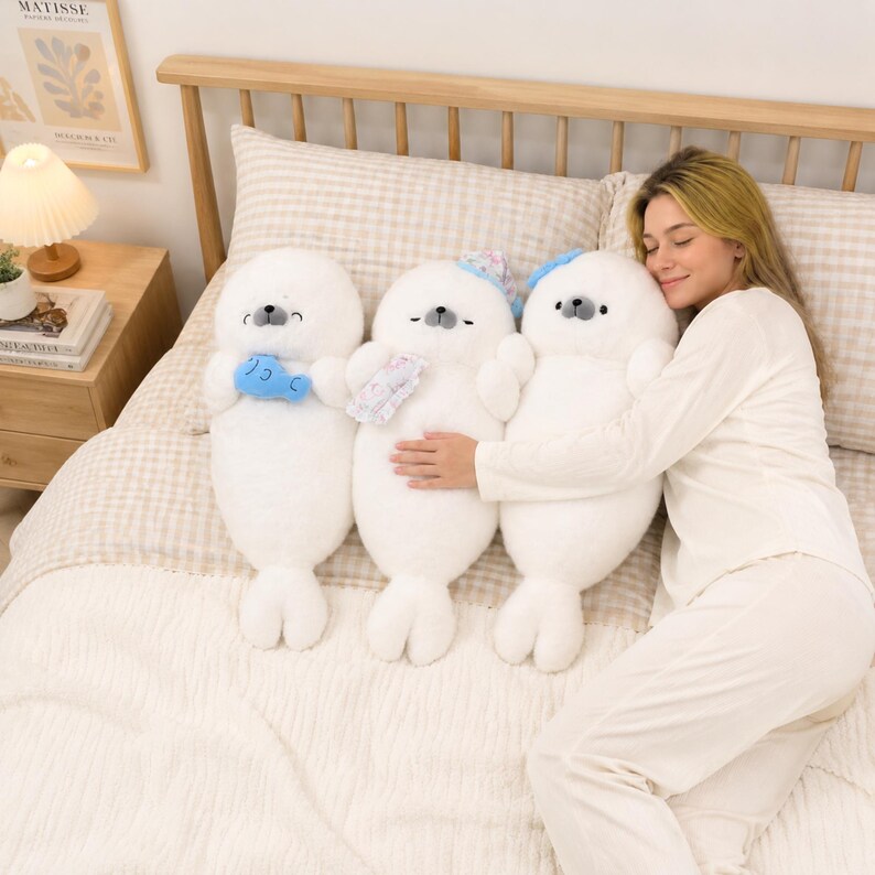 Kawaii sleeping seal plush with soft white plush fabric and PP cotton filling, cute seal pillow for kids and adults, large 70cm size perfect for cuddling and home decor, calming plush toy for bedrooms, sofas, and living room styling, adorable animal plushie for a cozy touch in any room, comforting seal stuffed animal for relaxation and stress relief, perfect gift for children and seal lovers, cute addition to any home decor collection