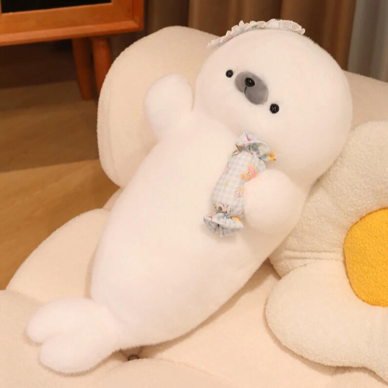 Kawaii sleeping seal plush with soft white plush fabric and PP cotton filling, cute seal pillow for kids and adults, large 70cm size perfect for cuddling and home decor, calming plush toy for bedrooms, sofas, and living room styling, adorable animal plushie for a cozy touch in any room, comforting seal stuffed animal for relaxation and stress relief, perfect gift for children and seal lovers, cute addition to any home decor collection