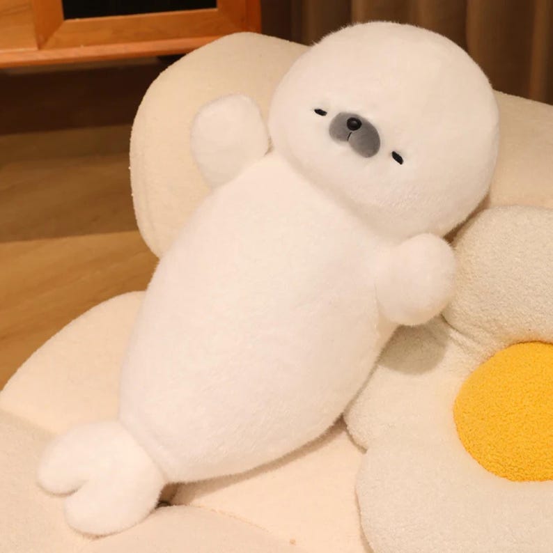Kawaii sleeping seal plush with soft white plush fabric and PP cotton filling, cute seal pillow for kids and adults, large 70cm size perfect for cuddling and home decor, calming plush toy for bedrooms, sofas, and living room styling, adorable animal plushie for a cozy touch in any room, comforting seal stuffed animal for relaxation and stress relief, perfect gift for children and seal lovers, cute addition to any home decor collection