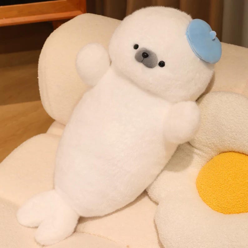 Kawaii sleeping seal plush with soft white plush fabric and PP cotton filling, cute seal pillow for kids and adults, large 70cm size perfect for cuddling and home decor, calming plush toy for bedrooms, sofas, and living room styling, adorable animal plushie for a cozy touch in any room, comforting seal stuffed animal for relaxation and stress relief, perfect gift for children and seal lovers, cute addition to any home decor collection