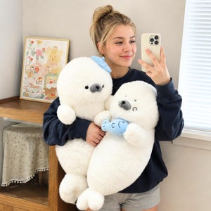 Kawaii sleeping seal plush with soft white plush fabric and PP cotton filling, cute seal pillow for kids and adults, large 70cm size perfect for cuddling and home decor, calming plush toy for bedrooms, sofas, and living room styling, adorable animal plushie for a cozy touch in any room, comforting seal stuffed animal for relaxation and stress relief, perfect gift for children and seal lovers, cute addition to any home decor collection