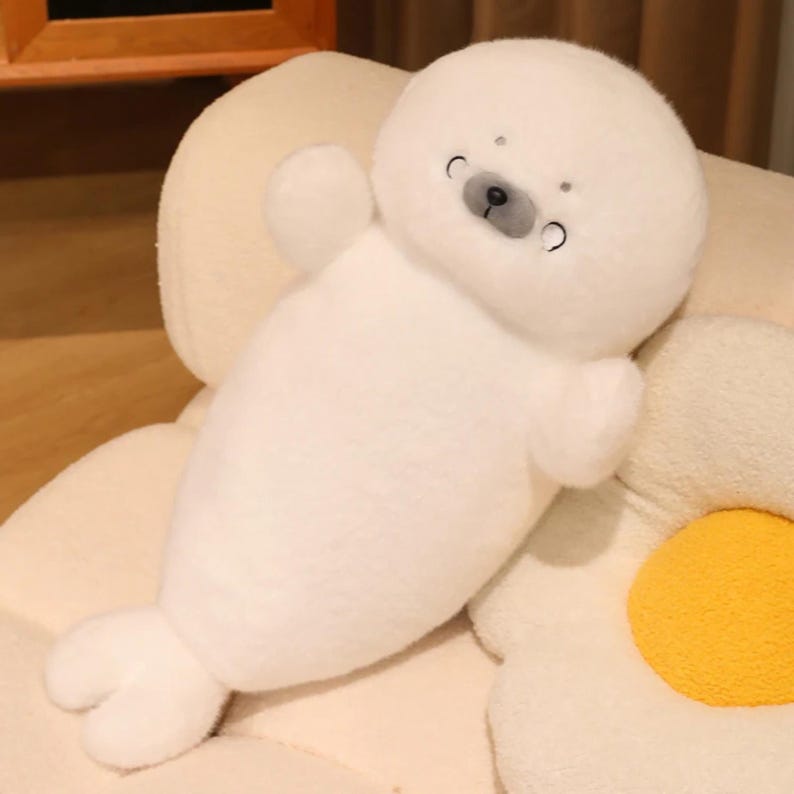 Kawaii sleeping seal plush with soft white plush fabric and PP cotton filling, cute seal pillow for kids and adults, large 70cm size perfect for cuddling and home decor, calming plush toy for bedrooms, sofas, and living room styling, adorable animal plushie for a cozy touch in any room, comforting seal stuffed animal for relaxation and stress relief, perfect gift for children and seal lovers, cute addition to any home decor collection