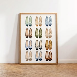 May include: A framed art print featuring a grid of twelve pairs of illustrated ballet flats in various colors and patterns, including solid pastels, earth tones, leopard print, and two-tone designs, all arranged in four rows of three pairs each.