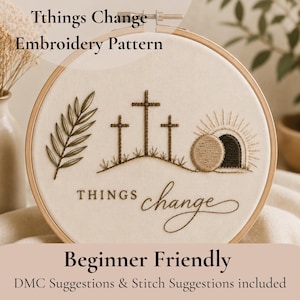 Puede incluir: Un bastidor de bordado con tela beige con un diseño de punto de cruz. El diseño incluye tres cruces, una tumba y el texto "Things Change". También se incluye el texto "Beginner Friendly".