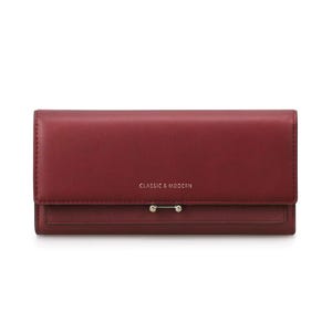 May include: A rectangular dark red wallet with a smooth finish. The front flap features the text CLASSIC & MODERN in small gold lettering and a horizontal silver-toned metal bar accent with two small spheres at the ends centered on the flap.