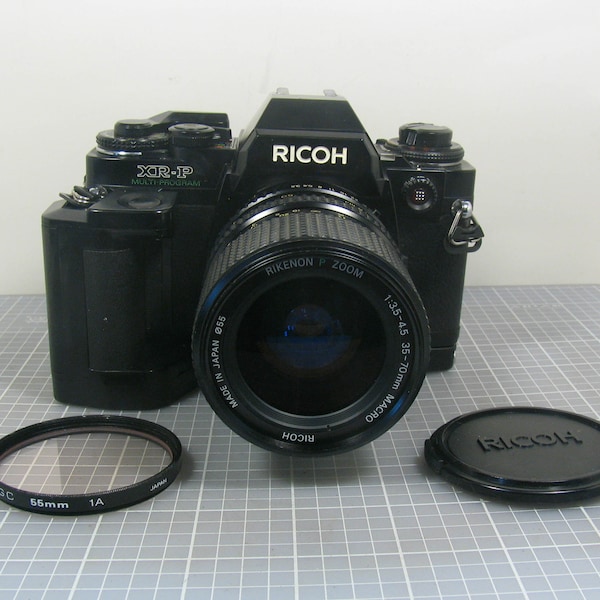 Ricoh XR-P Multi-Program 35mm SLR Film Camera with a Rikenon P Zoom 35-70mm lens and the Power Grip PG-4