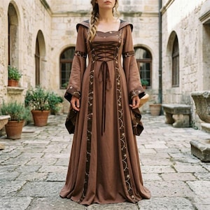 May include: A brown medieval-style dress with long, flared sleeves and a hood. The dress features a laced bodice and decorative trim with embroidered star-like patterns. The dress is floor-length and made of a flowing fabric, suitable for historical reenactments or themed events.