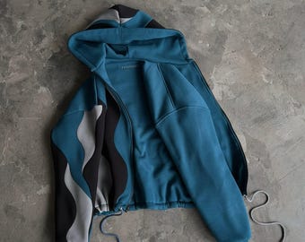 Übergroßer türkisfarbener und anthrazitfarbener gewellter Zip-Hoodie mit Wendedesign