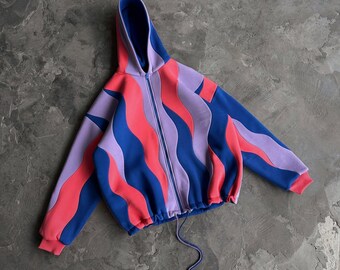 Übergroßer Reversi-Hoodie mit blauem und magentafarbenem Wellenmuster