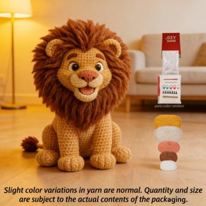 May include: A crocheted lion with a brown mane and a smiling expression. The lion is sitting on a wooden surface. The image also shows a DIY kit with yarn in various colors, including yellow, white, peach, and brown. The text in the image says "DIY".