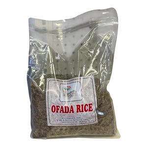 May include: A clear plastic bag filled with Ofada rice. The bag has a label with the words "Ofada Rice" in red letters. The label also includes a logo and contact information. The rice appears to be a mix of brown and white grains.