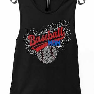 May include: Black tank top with a baseball design. The words "Baseball Mom" are in red and blue glitter. A baseball is below the text, also in glitter. The tank top is hanging on a black hanger.