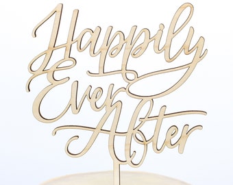 May include: Wooden cake topper with the words "Happily Ever After" in a cursive font.