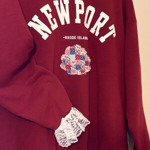 Lace, patchwork clamshells and a whole lotta red! This crew neck is the perfection addition to your summer wardrobe