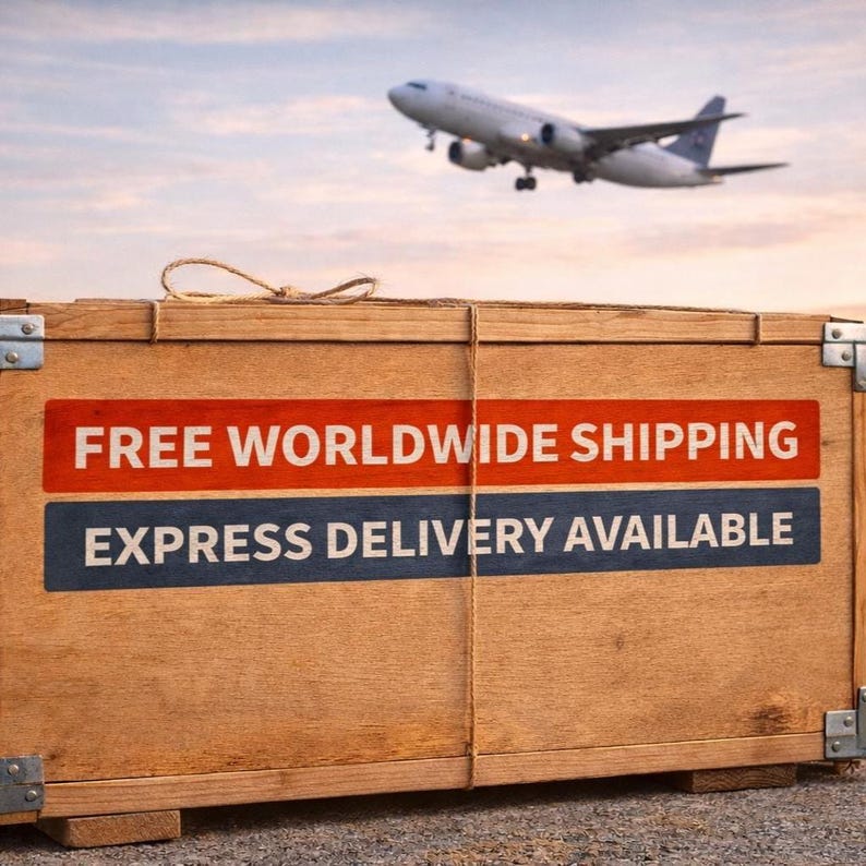 May include: A rectangular wooden shipping crate with metal corner reinforcements and a twine tie on top. The front panel features two horizontal rectangular bands with the text FREE WORLDWIDE SHIPPING and EXPRESS DELIVERY AVAILABLE.