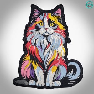 May include: An embroidered patch featuring a long-haired cat with a multi-colored coat of yellow, red, blue, and white threads. The cat is depicted in a seated position with bright yellow eyes, a pink nose, and a thick black border outline.