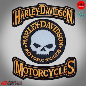 May include: Set of three Harley-Davidson motorcycle patches. The patches include the Harley-Davidson logo, a skull design, and the word "Motorcycles". The patches are black with gold and white accents.