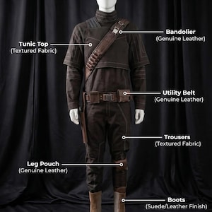 May include: A full costume on a mannequin, featuring a tunic top, bandolier, utility belt, trousers, leg pouch, and boots. The costume is predominantly brown, with textured fabric and leather details. The boots have a suede/leather finish. The text "Costume Includes" is at the top.
