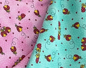 Fabbies T-shirt fabric with insects on a green background