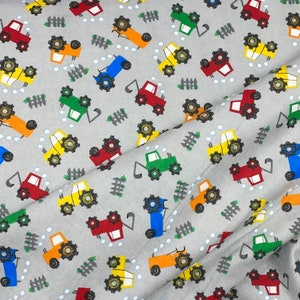 Dump trucks. delivery truck, cement trucks, loader backhoe Flannel, gray, blue baby boy fabric, orange red blue yellow vehicles, cars,