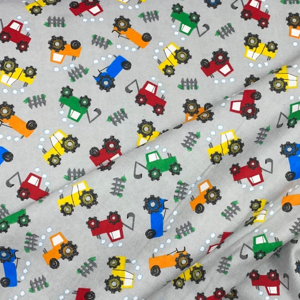 Dump trucks. delivery truck, cement trucks, loader backhoe Flannel, gray, blue baby boy fabric, orange red blue yellow vehicles, cars,