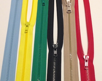 May include: Six different colors of zipper tape, including light blue, yellow, green, black, beige, and red. The zippers are all open and the slider is visible.