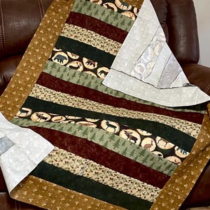 Wilderness hunting Man Cave, cabin quilt top, brown beige green, bear moose, pine trees, pine cones, unfinished flannel woodland quilt top