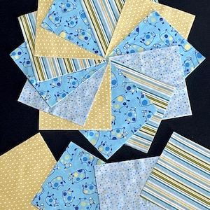 May include: A collection of 12 fabric squares in various patterns, including blue with white polka dots, blue with yellow polka dots, blue with cow print, yellow with white polka dots, and green and blue stripes. The squares are all approximately 5 inches by 5 inches.
