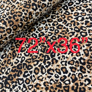 May include: Brown and black leopard print fabric with a white background. The fabric is folded in half and the text "72" x "36" is printed in red on the fabric.