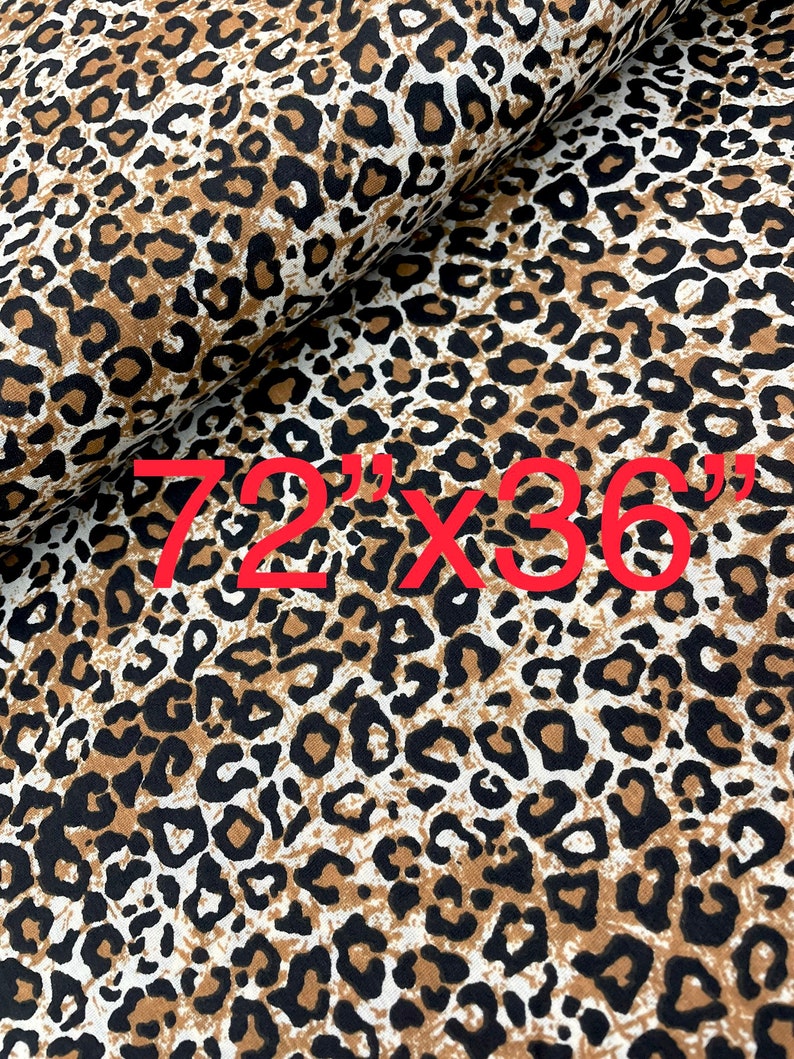 May include: Brown and black leopard print fabric with a white background. The fabric is folded in half and the text "72" x "36" is printed in red on the fabric.