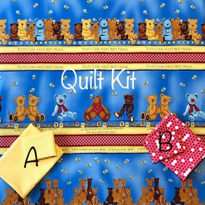 May include: A quilt kit with a blue fabric design featuring teddy bears, bees, and text. The kit includes two fabric pieces: a yellow textured piece and a red and white polka dot piece. The words "Quilt Kit" are also visible.
