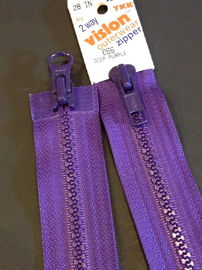 May include: A 28 inch purple zipper with a YKK Vislon outerwear zipper pull. The zipper is labeled "#66 Deep Purple".