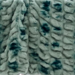 May include: A plush, textured fabric featuring a repeating pattern of soft, light gray fur-like ridges interspersed with deep teal, mottled patches. The material has a dense, high-pile appearance with vertical rows of raised, wavy tufts.