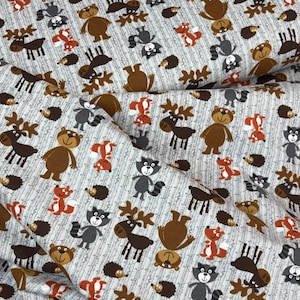 May include: Fabric featuring a repeating pattern of cartoon forest animals, including bears, raccoons, foxes, moose, and hedgehogs in brown, grey, and orange on a light grey background with vertical lines. Ideal for children's crafts.