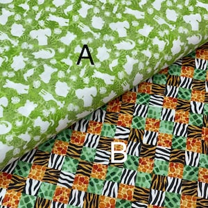 May include: Two fabric swatches with different patterns. The top swatch is green with white silhouettes of animals, including elephants, giraffes, and zebras. The bottom swatch is a patchwork of green, orange, black, and white animal print patterns. The swatches are labeled "A" and "B".