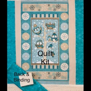 May include: A teal blue quilt kit with a winter owl theme. The kit includes a backing fabric and binding fabric. The center panel features a tree with owls and the text "Quilt Kit".