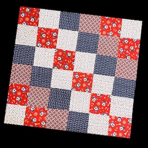 May include: A red, white, and blue patchwork quilt with a nautical theme. The quilt features a repeating pattern of Mickey Mouse heads with anchors and steering wheels.