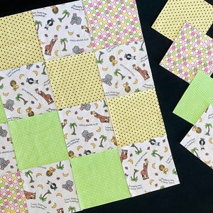 May include: A patchwork quilt made of 12 squares of fabric. The squares are in various patterns, including polka dots, gingham, and a white background with a repeating pattern of animals and text. The text on the squares reads "Sweet Dreams Baby Bugs" and "Sleepy Snoozy Friends".
