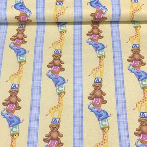 May include: Yellow fabric with a repeating pattern of blue stripes and stacked toy animals. The animals include a giraffe, a teddy bear, and an elephant. Each animal is standing on a block with a letter on it. The letters are A, B, and C.